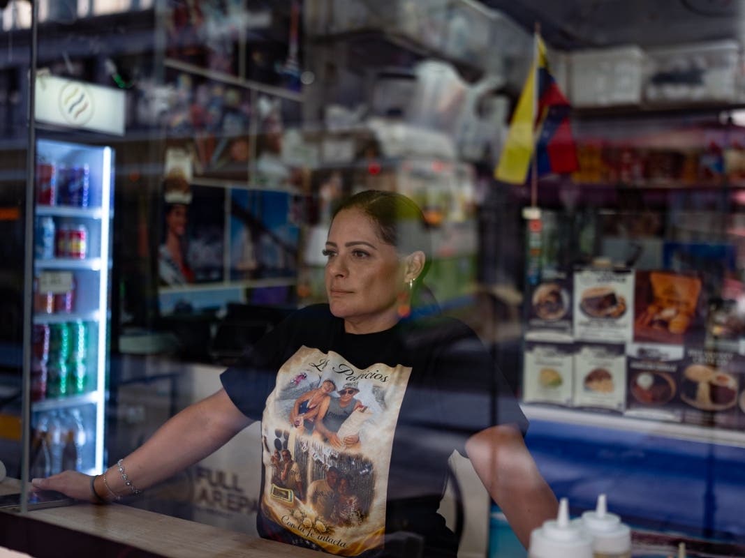 Kelly Granado, whose parents died in Venezuela's June 24 earthquakes, poses for photos at her restaurant in downtown Los Angeles, Tuesday, Aug. 25, 2026.