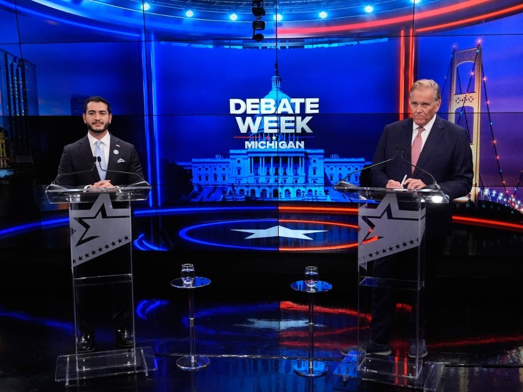 Democratic nominee for U.S. Senate Abdul El-Sayed, left, appears with Republican nominee for U.S. Senate Mike Rogers during a televised debate at WOOD-TV, on Thursday, Oct. 8, in Grand Rapids.