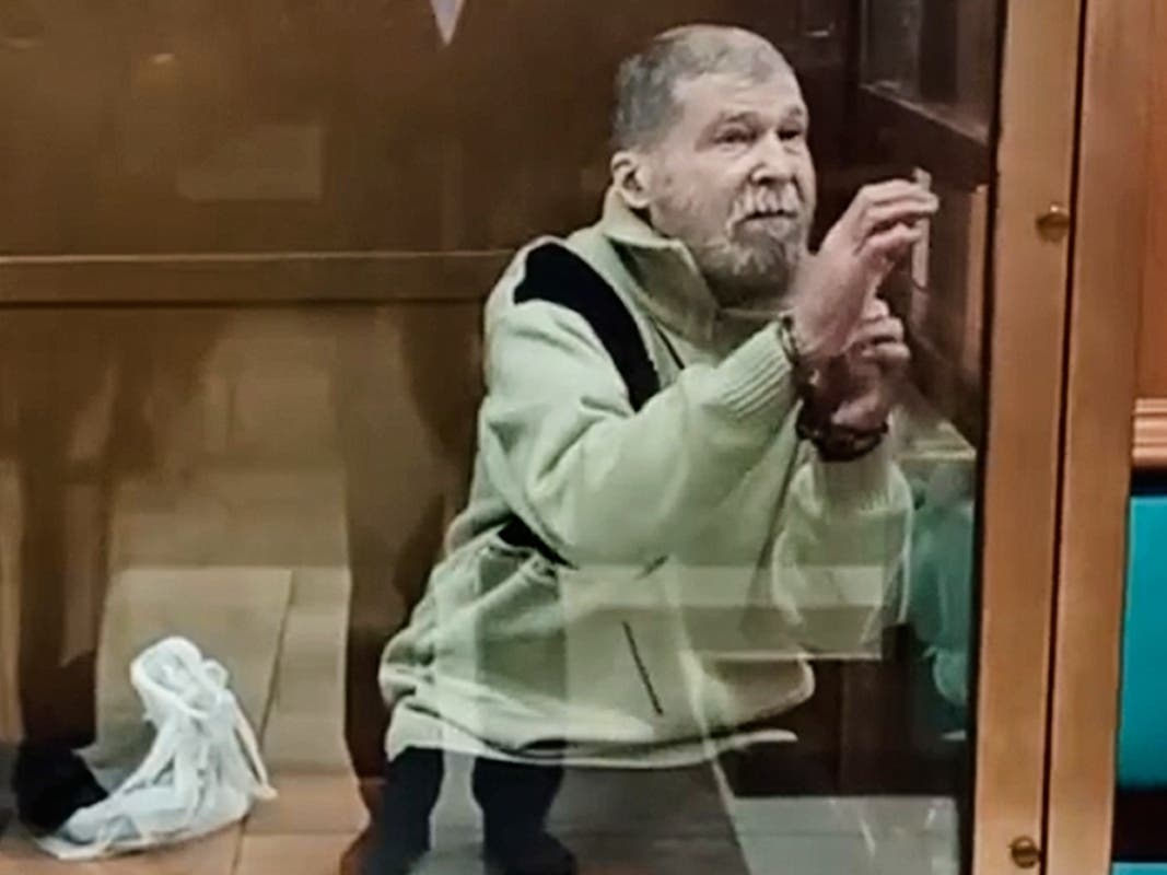 In this photo taken from video released by the Moscow City Court Press Service, Stephen Hubbard, a U.S. citizen accused of fighting as a mercenary in Ukraine against Russia stands in a glass cage during a court session in the Moscow City court in Moscow.