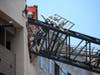 Image shows a crane that fell Sunday on an apartment building in Dallas.