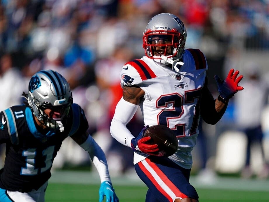 New England Patriots cornerback J.C. Jackson runs for a touchdown after an interception against the Carolina Panthers during the second half of an NFL football game Nov. 7, 2021, in Charlotte, N.C. 