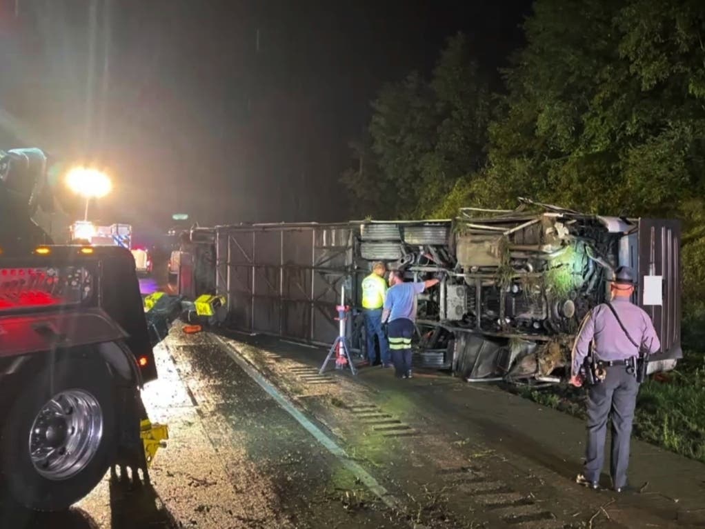 Police and rescue workers arrive on the scene of a bus crash late Sunday, Aug. 6, 2023, in Lower Paxton Township, Dauphin County ,Pa. The crash occurred between a passenger vehicle and charter bus carrying up to 50 passengers.