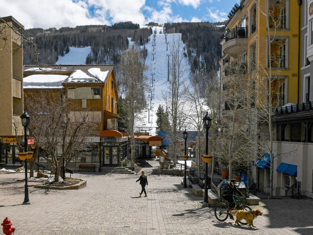 This photo, taken Tuesday, shows ski lifts empty in Vail after Vail Ski Resort closed for the season amid the COVID-19 pandemic. The closure has ended the normally busy spring ski season more than a month early. 