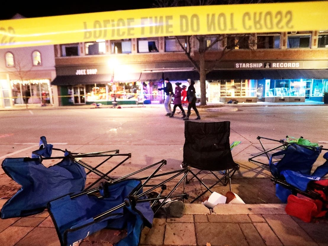 Toppled chairs line West Main Street in downtown Waukesha, Wisconsin, on Sunday after an SUV drove into a parade of Christmas marchers.