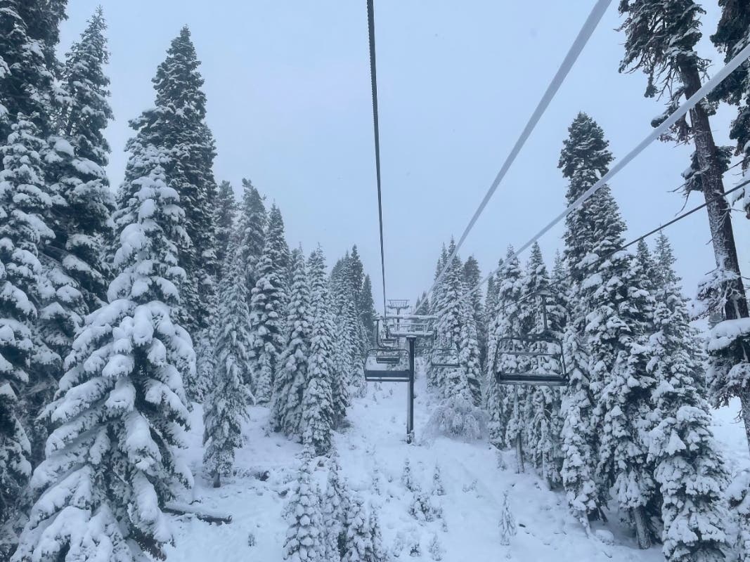 In this photo provided by the Northstar Ski Resort, fresh snow surrounds a ski lift in Truckee, California, on Monday. 