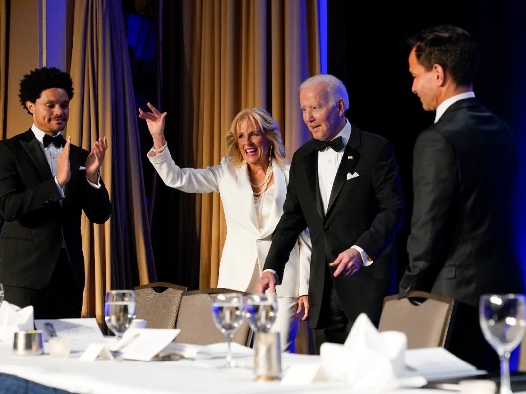 President Joe Biden and first lady Jill Biden arrive at the annual White House Correspondents' Association dinner Saturday n Washington. At left is comedian Trevor Noah, who hosted the roast.