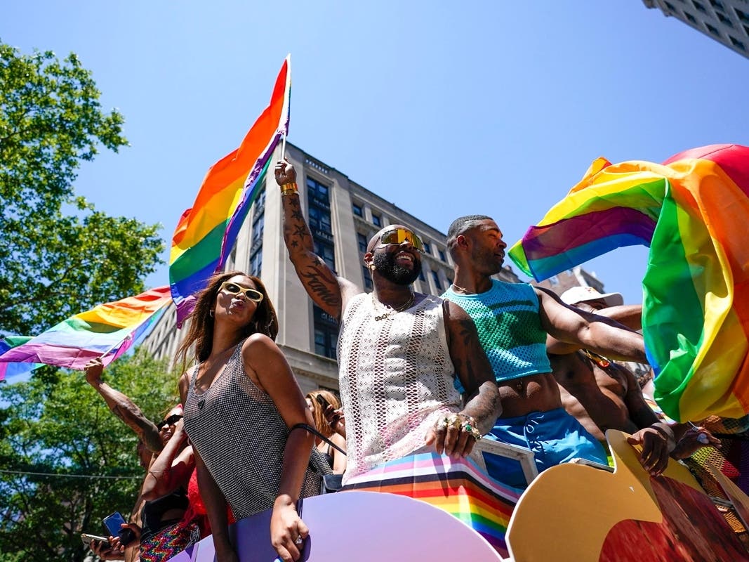 Revelers march down Fifth Avenue during the annual NYC Pride March on Sunday in New York. 