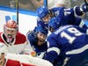 Lightning center Anthony Cirelli (71) and right wing Barclay Goodrow (19) congratulate center Blake Coleman (20) on his diving goal past Montreal Canadiens goaltender Carey Price (31). 