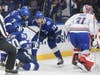 Lightning center Anthony Cirelli (71) and right wing Barclay Goodrow (19) congratulate center Blake Coleman (20) on his diving goal past Montreal Canadiens goaltender Carey Price (31). 