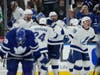 Tampa Bay Lightning players celebrate after defeating the Toronto Maple Leafs in Game 7 of the first-round playoff series in Toronto, Saturday.