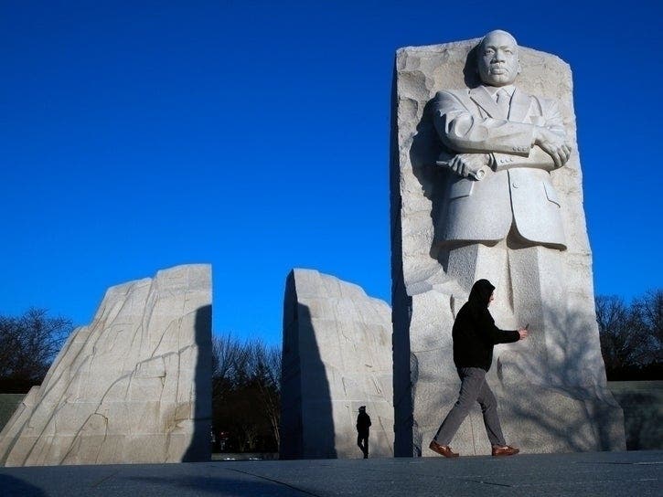 People visit the Martin Luther King, Jr. Memorial on MLK Day, Monday, Jan. 21, 2019, in Washington.