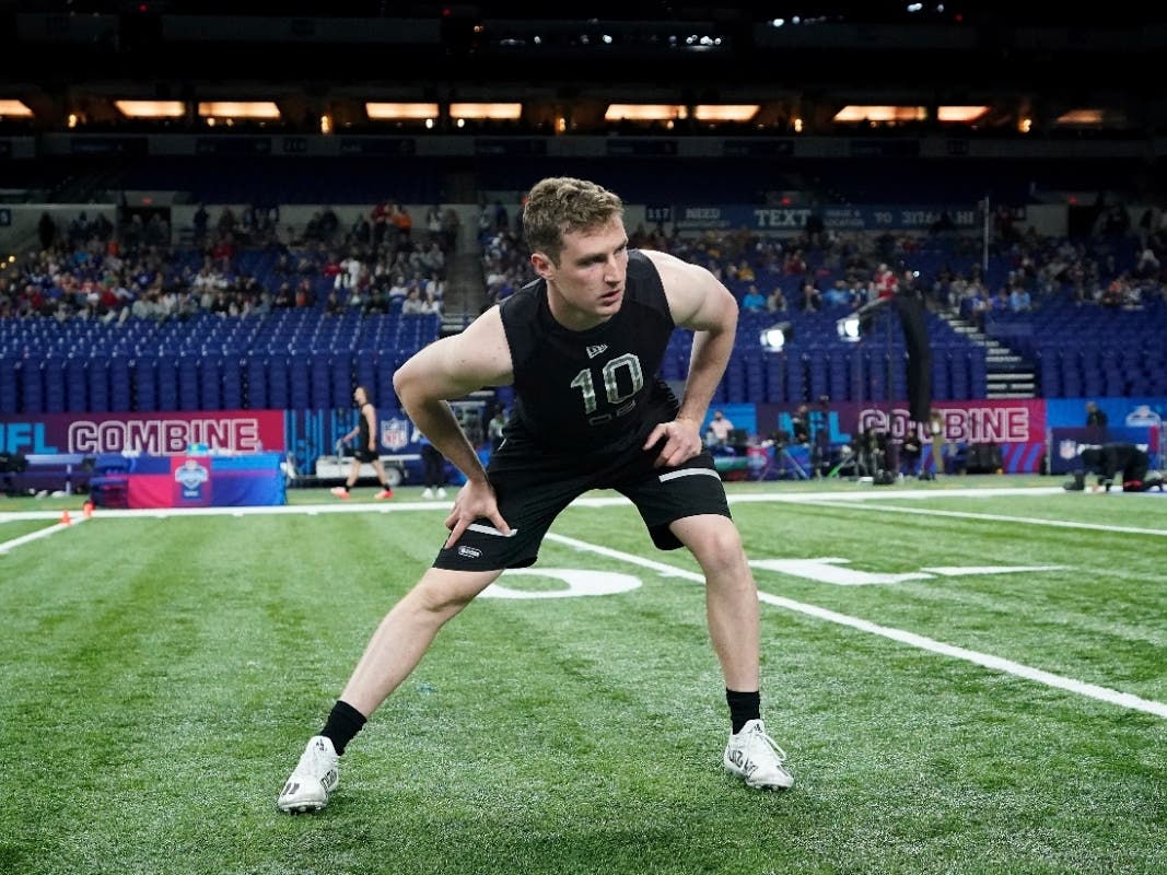 Brown quarterback EJ Perry (10) warms up at the NFL football scouting combine in Indianapolis, Thursday, March 3, 2022. 