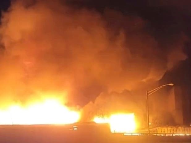 A fire at a New Jersey chemical plant with flames and smoke visible for miles in the night sky Friday has spread to multiple buildings, threatening to reach the plant's chemical storage area, authorities said.