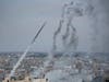 Rockets are launched by Palestinian militants from the Gaza Strip towards Israel, in Gaza, Saturday, Oct. 7, 2023. The militant Hamas rulers of the Gaza Strip carried out an unprecedented, multi-front attack on Israel at daybreak Saturday.