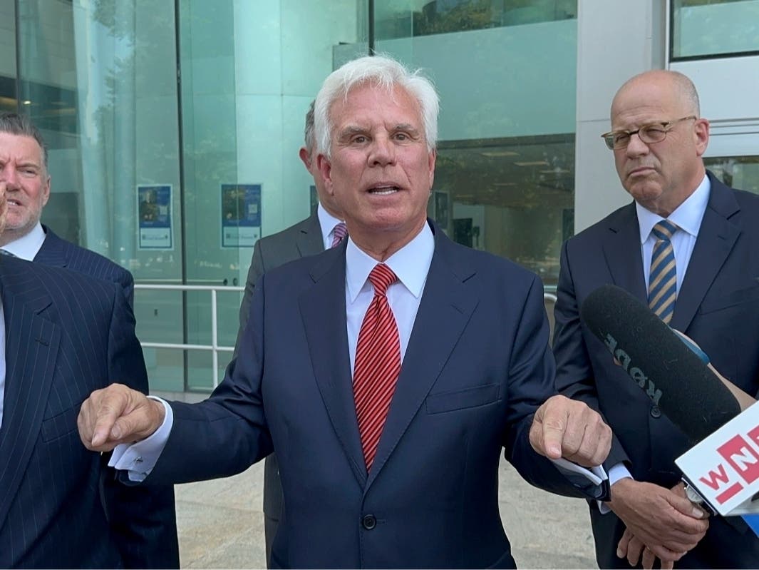 Influential Democratic power broker George Norcross, center, speaks outside the justice complex in Trenton, N.J., Monday, June 17, 2024, about being charged with racketeering and other charges in connection with government issued tax credits.