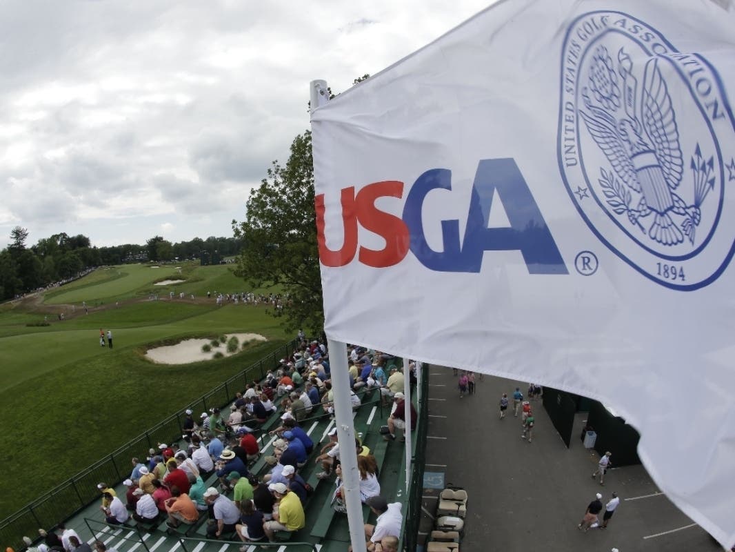 The USGA flag waves during practice for the U.S. Open golf tournament at Merion Golf Club in Ardmore, Pa.