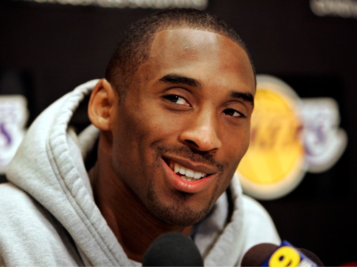 FILE - Los Angeles Lakers basketball star Kobe Bryant smiles as he talks about his 81-point game Jan. 22, 2006, against the Toronto Raptors at Lakers headquarters in El Segundo, Calif., Jan. 24, 2006.