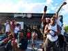 Protesters demonstrate outside a Wendy's restaurant in Atlanta on Saturday before the building was set ablaze.