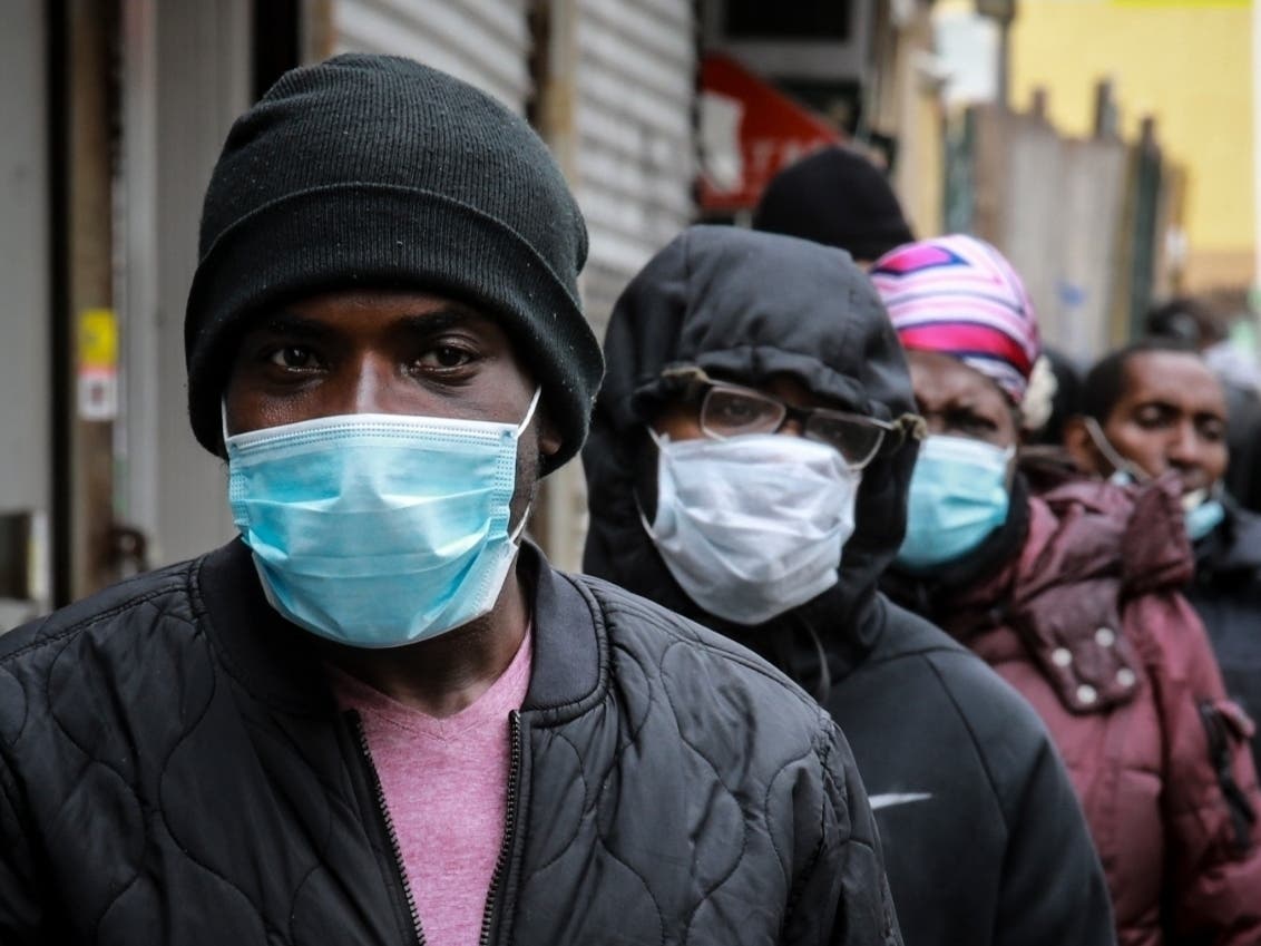 Residents in New York City wait in line for a distribution of food and masks. Since March, about one in six American workers have lost their jobs.
