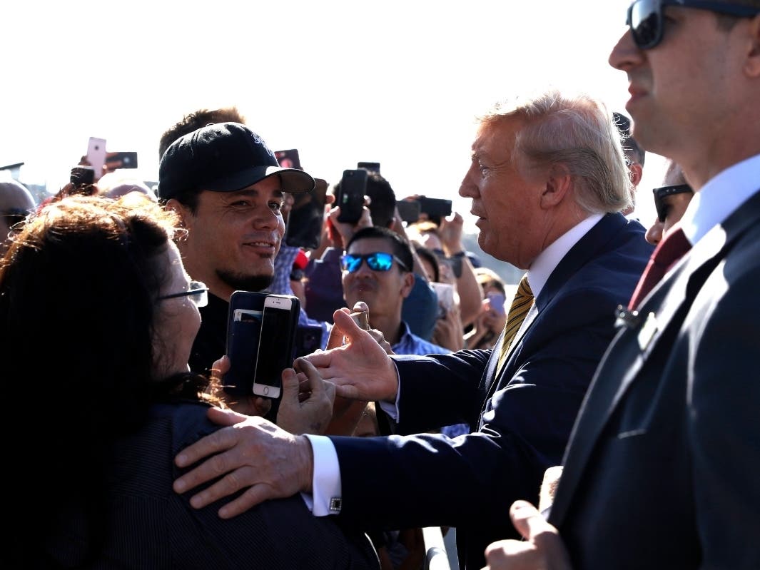 President Donald Trump greets supporters as he arrives at at Los Angeles International Airport to attend a fundraiser, Tuesday, Sept. 17, 2019, in Los Angeles.