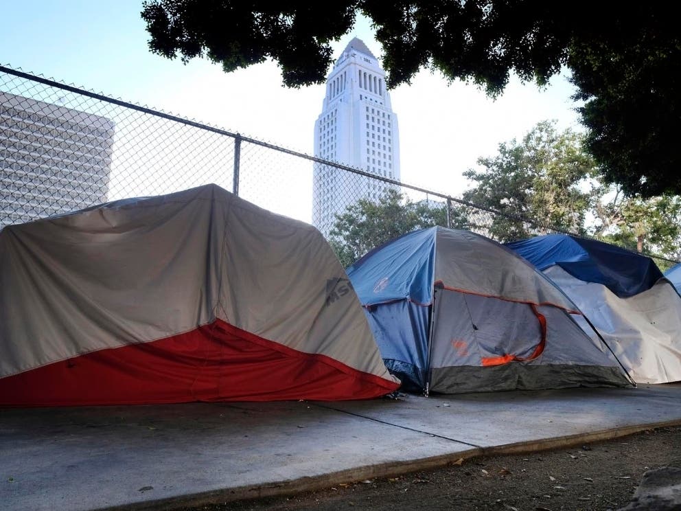 As overnight temperatures dropped to the mid 40s, a 54-year-old homeless man died in the shadow of Los Angeles City Hall.