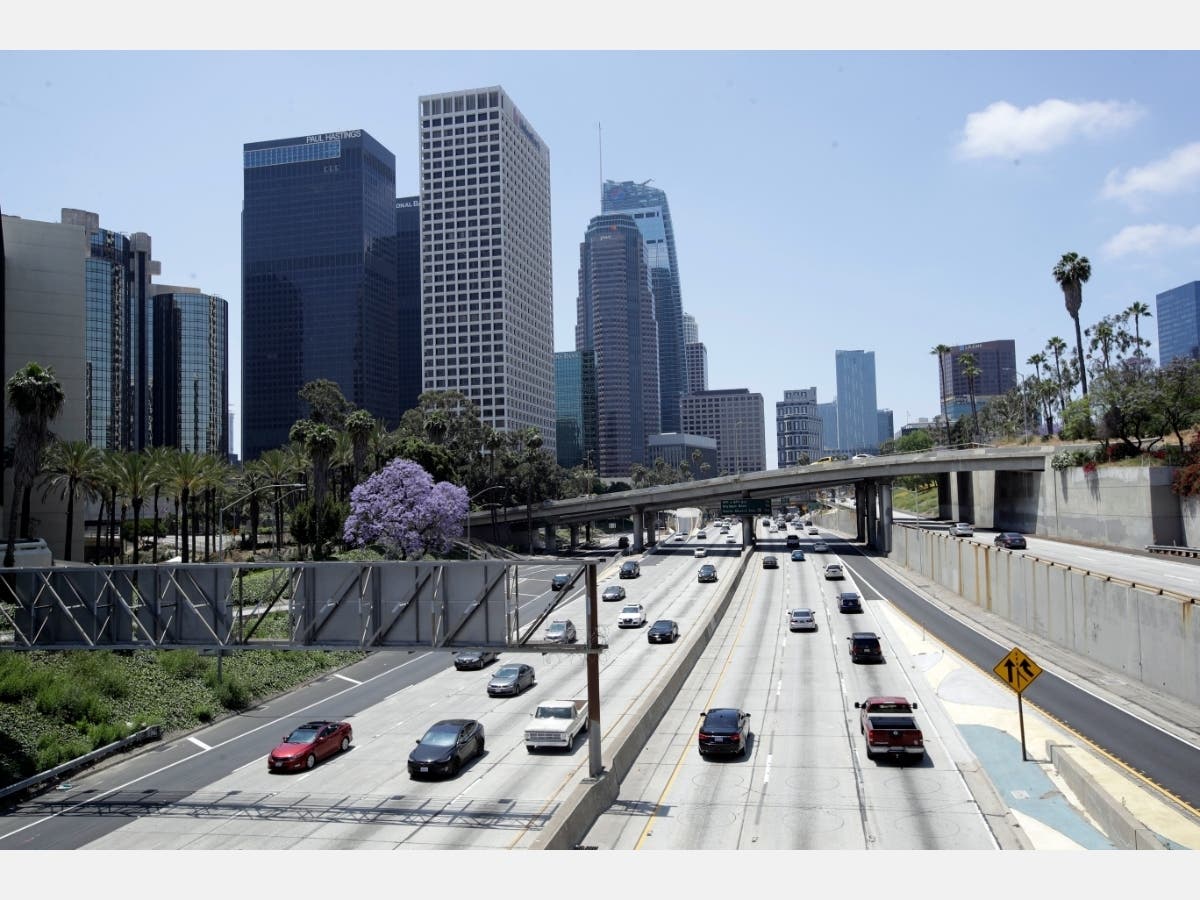 Traffic flows on California 110 on Monday, May 11, 2020, in Los Angeles. Americans are slowly getting back on the road after hunkering down amid the coronavirus pandemic.