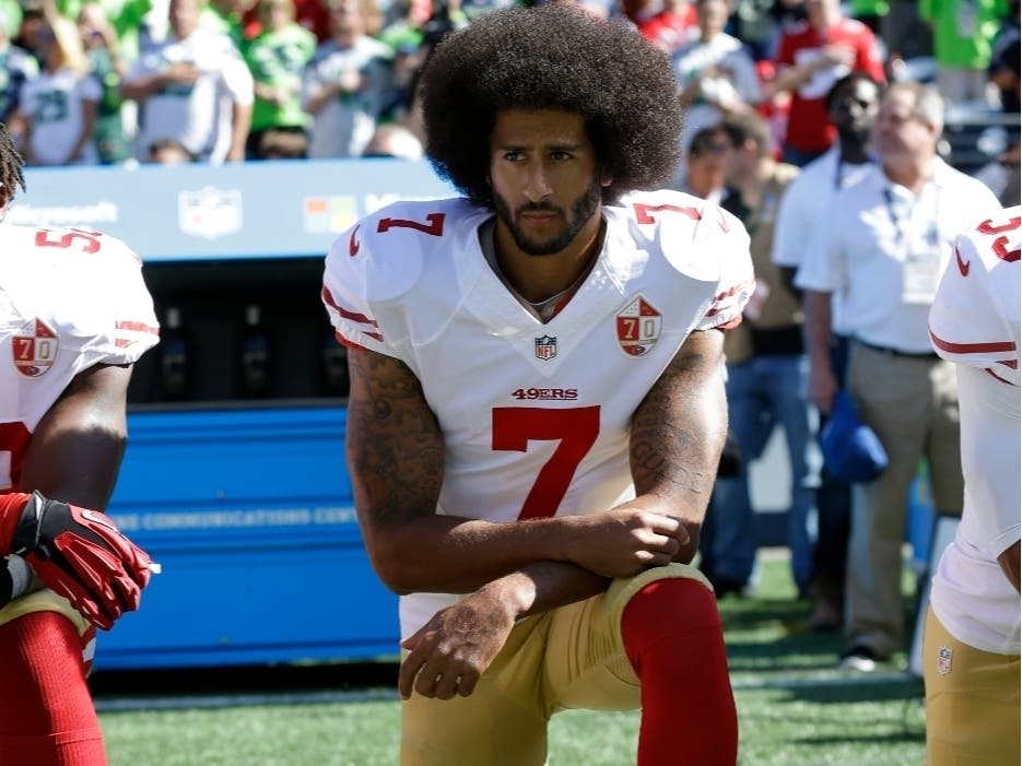 In this Sept. 25, 2016, file photo, San Francisco 49ers' Colin Kaepernick kneels during the national anthem before an NFL football game against the Seattle Seahawks in Seattle