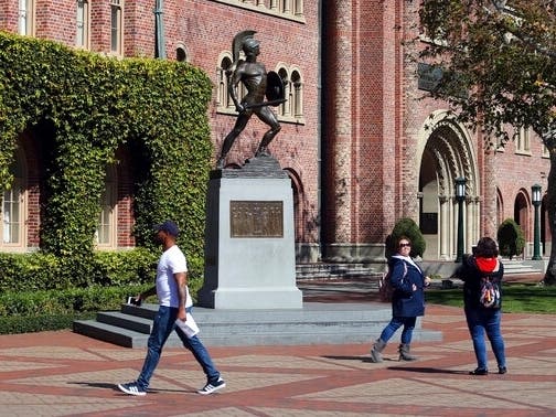 A former USC admissions official accused of accepting thousands of dollars in payments to ensure graduate-school admission for unqualified international students is expected to plead guilty Monday to a federal fraud charge.