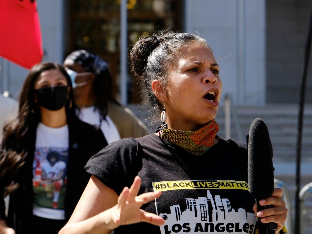 The Los Angeles Police Department is investigating an apparent "swatting" call that brought armed officers Wednesday to the Mid- City home of Melina Abdullah, co-founder of Black Lives Matter Los Angeles.