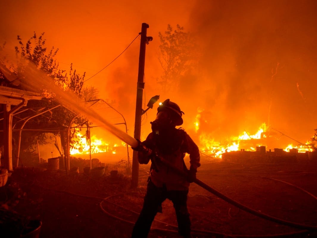 A firefighter works against the Lake Hughes fire in Angeles National Forest 