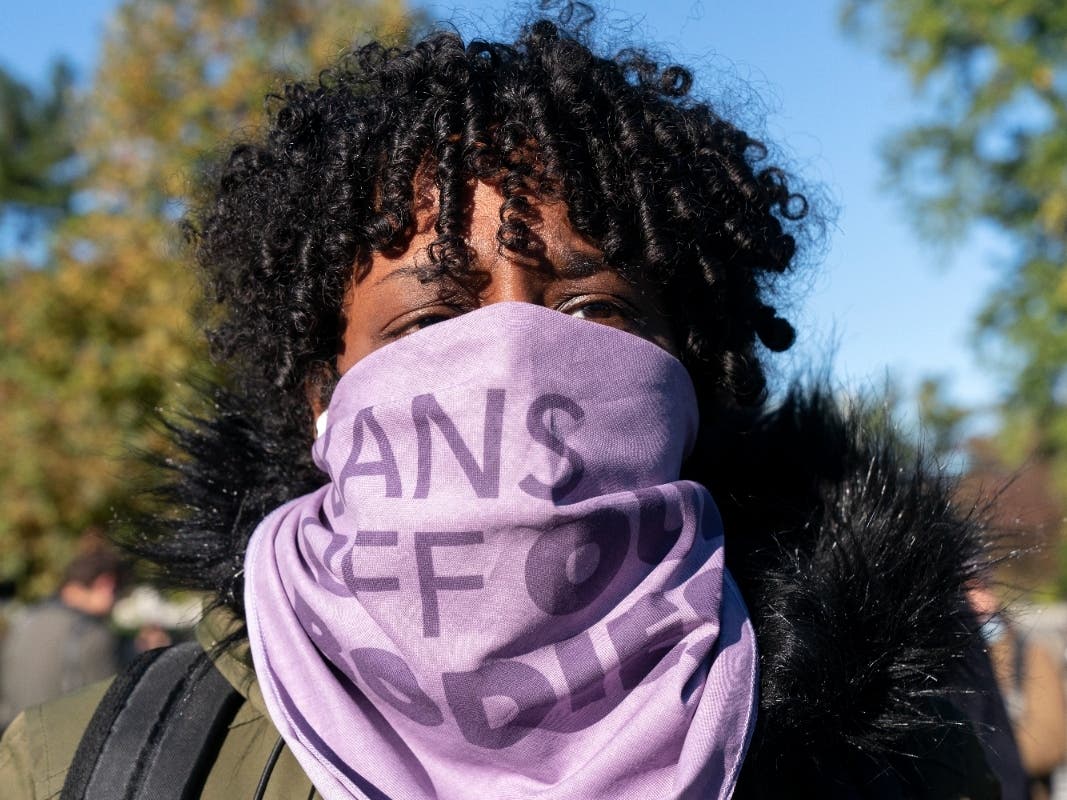 Wearing a bandana saying "bans off our bodies," Bethelehem Yirga, of Prince George's County, Md., joins an abortion-rights rally outside the U.S. Supreme Court in Washington, Monday, Nov. 1, 2021, as arguments are set to begin about abortion. 