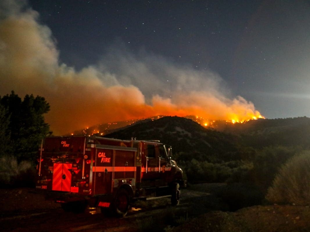 A fire engine is seen as the Sheep fire burns in Wrightwood, Calif., Monday, June 13, 2022. 