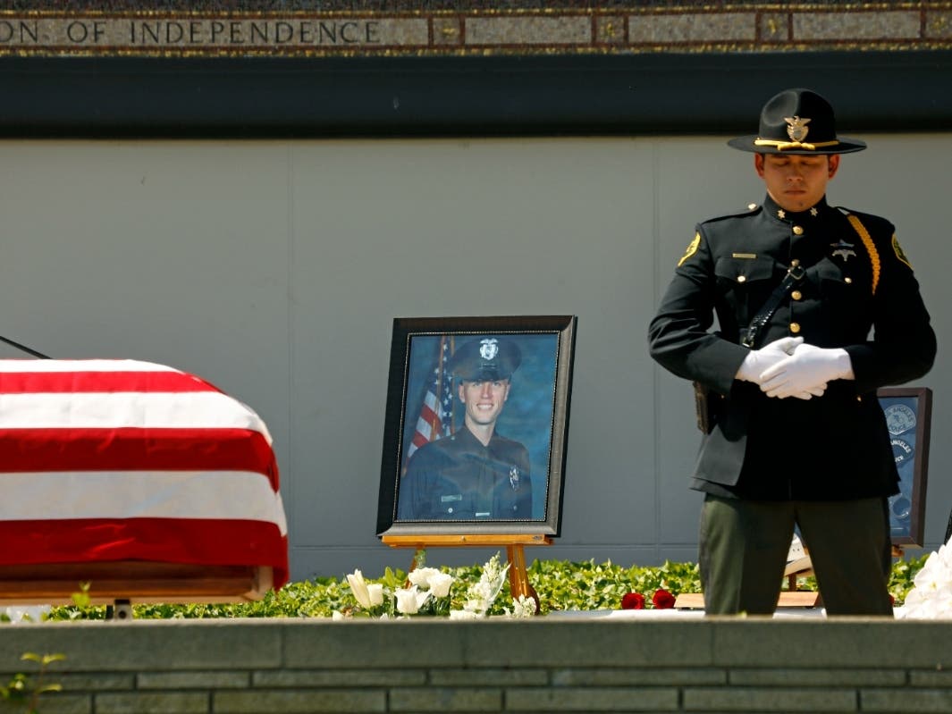 A picture of Los Angeles Police Officer Houston Tipping is set on the deck where his memorial was held at Forest Lawn Hollywood Hills on Wednesday in Los Angeles. Officer Tipping died Sunday, May 29 after being injured in a training accident.