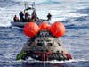 NASA's Orion capsule is drawn to the well deck of the USS Portland after it splashed down following a successful uncrewed Artemis I moon mission, Sunday, Dec. 11, 2022, in the Pacific Ocean off the coast of Baja California, Mexico.  