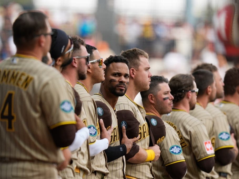San Diego Padres' Xander Bogaerts, center, and teammate stand line prior to a baseball game against Arizona Diamondbacks in Mexico City, Saturday, April 25, 2026.
