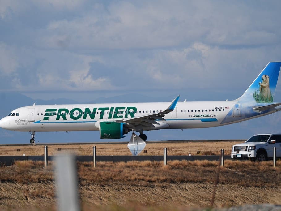 A Frontier Airlines jetliner taxis down a runway for takeoff from Denver International airport on Nov. 25, 2025, in Denver. 