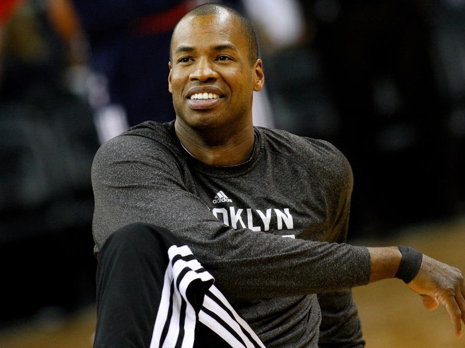 Brooklyn Nets center Jason Collins warms up before an NBA basketball game in New Orleans, March 24, 2014.