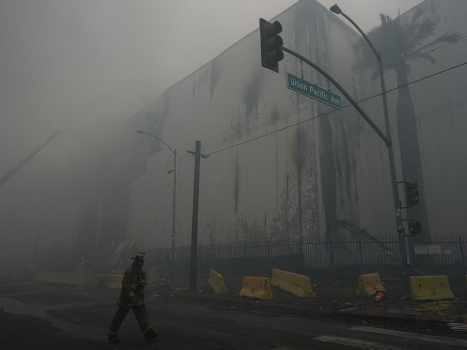 Smoke from a warehouse fire fills the air in the Boyle Heights neighborhood of Los Angeles, Sunday, June 21, 2026.
