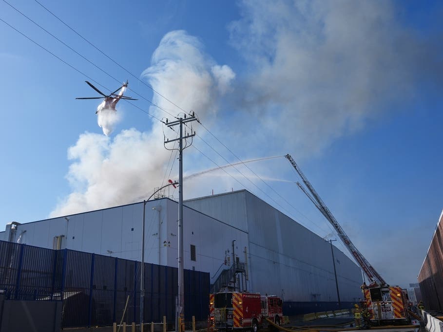 Water is dropped by helicopter at a warehouse fire in Boyle Heights on Wednesday, June 17, 2026.