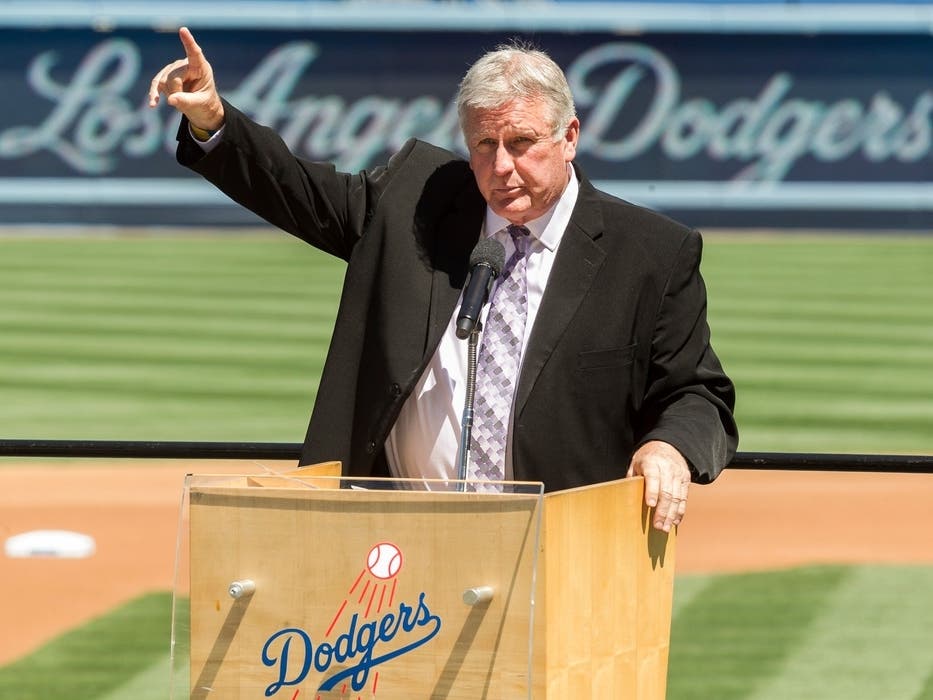 Los Angeles Dodgers former pitcher Tommy John praises his late friend, Dr. Frank Jobe during a memorial service at Dodger Stadium in Los Angeles, April 7, 2014.