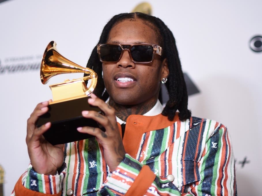 Lil Durk poses in the press room with the award for best melodic rap performance for "All My Life" by Lil Durk featuring J. Cole during the 66th annual Grammy Awards, Feb. 4, 2024, in Los Angeles.