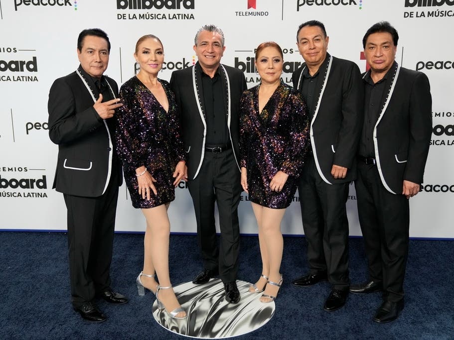 Los Ángeles Azules poses on the blue carpet at the Latin Billboard Awards, in Coral Gables, Fla., Thursday, Oct. 5, 2023.