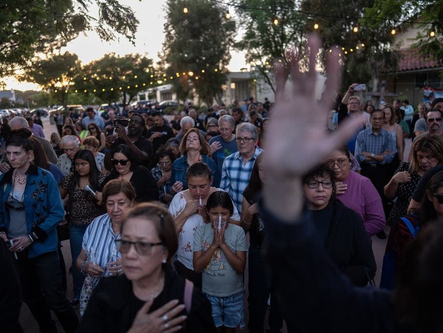 People attend a vigil for the victims of Tuesday's fatal SUV-Metro bus collision and the subsequent crash of a TV news helicopter covering it in the Chatsworth neighborhood of Los Angeles, Thursday, Sept. 17, 2026.