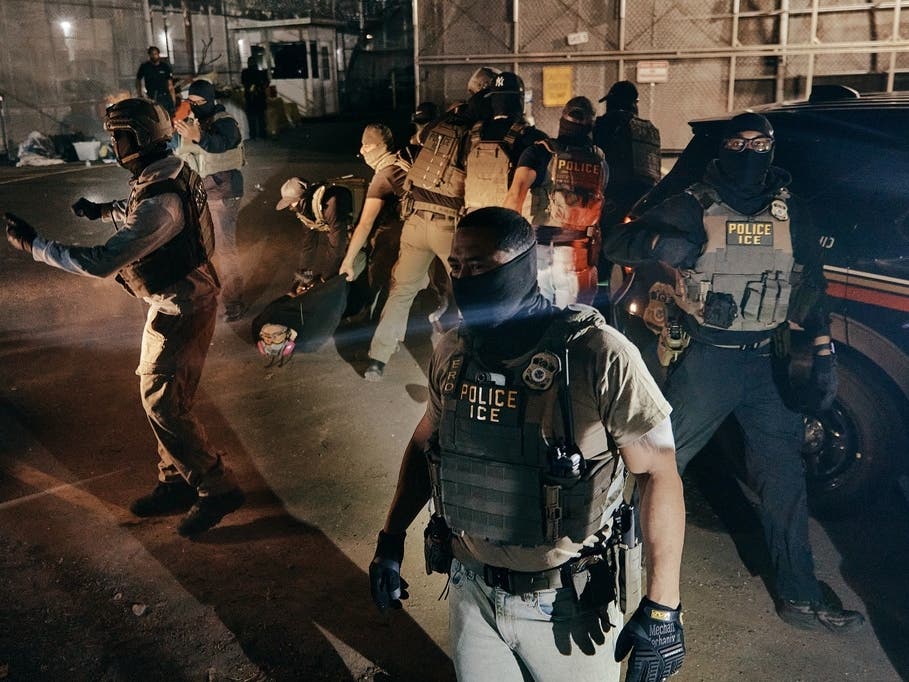 ICE agents make an arrest as they clash with protesters.