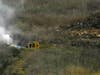 Firefighters work the scene of a helicopter crash where former NBA star Kobe Bryant died, Sunday, Jan. 26, 2020, in Calabasas, Calif.