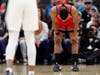 Toronto Raptors guard Kyle Lowry (7) holds his head down as players stop the action of a basketball game during the first half against the San Antonio Spurs to honor former NBA player Kobe Bryant in San Antonio, Sunday, Jan. 26, 2020.
