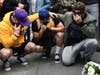 Los Angeles Laker fans Alex Fultz, from left, Eddy Rivas and Rene Alfaro mourn retired NBA star Kobe Bryant outside of the Staples Center prior to the 62nd annual Grammy Awards on Sunday, Jan. 26, 2020, in Los Angeles.