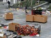 Workers remove thousands of items left in honor of Kobe Bryant, including hundreds of basketballs, from X-Box Plaza across Chick Hearn Court from Staples Center, home of the Los Angeles Lakers, early Monday, Feb. 3, 2020, in Los Angeles.