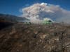 Some rises behind an area burned by a brush fire at the Apple Fire in Cherry Valley, Calif., Saturday, Aug. 1, 2020.