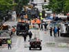 Police and city workers fill a street occupied hours earlier by an encampment of protesters Wednesday, July 1, 2020, in Seattle, where streets had been blocked off in an area demonstrators had occupied for weeks.